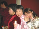 Three St Clare's students in traditional costume - Chinese New Year 2003