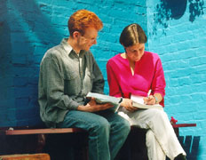 A St Clare's teacher advises a student in a one-to-one tutorial