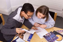 Two St Clare's students studying in the Academic Resources Centre Library