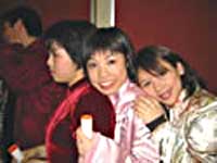 Three St Clare's students in traditional costume - Chinese New Year 2003