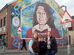 Tour leaders, Kevin Hennessy, Andrew Young, Meg Claringbold outside the Sinn Fein Headquarters in Belfast 