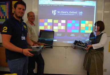 Head of Science Ian Gil with donations for Sierra Leone schools from St. Clare's