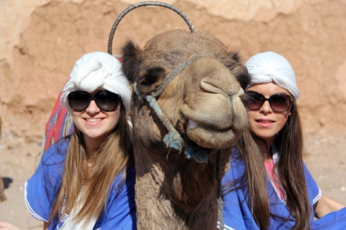 St. Clare's students pose with a camel in Marrakech