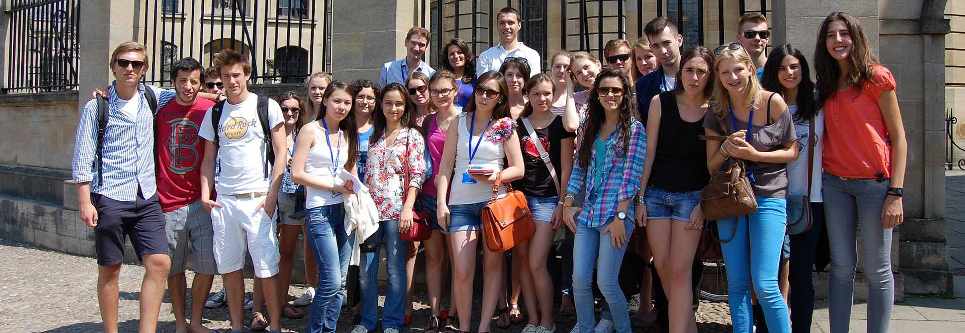 Students from St Clare's Oxford in front of the steps of the Sheldonian