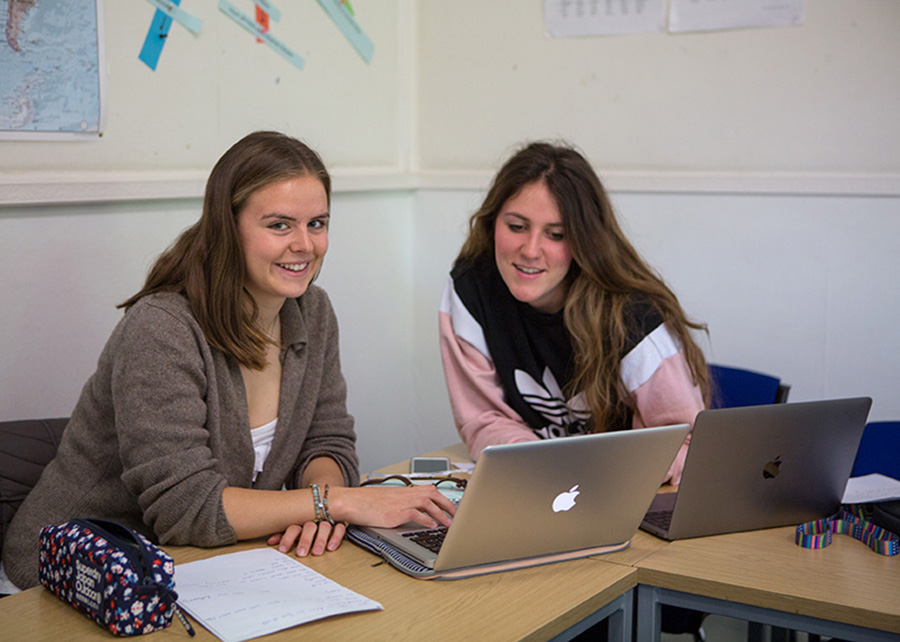 two teenage students in summer classroom lesson