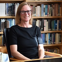 Ida Kenward Swedish teacher at St Clare's Oxford Ida Kenward sitting in the library at St Clare's Oxford