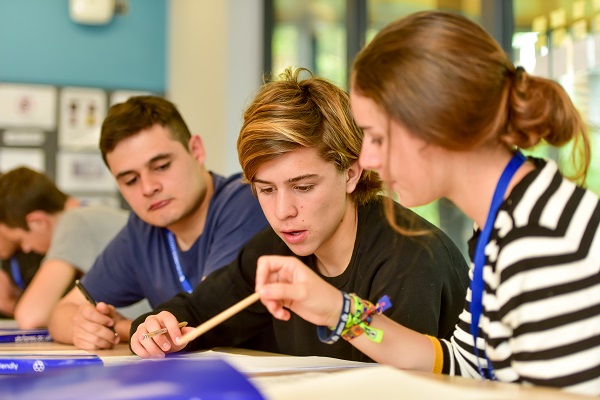 two teenage students in summer classroom lesson