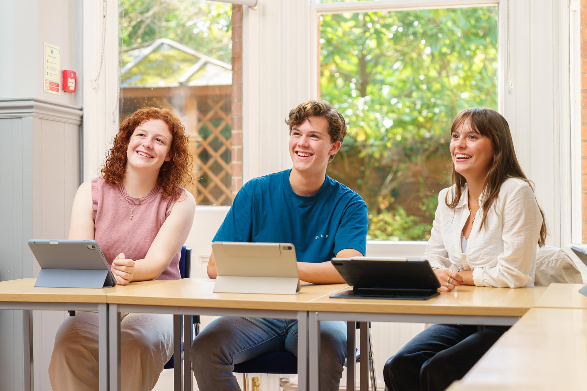 two teenage students in summer classroom lesson