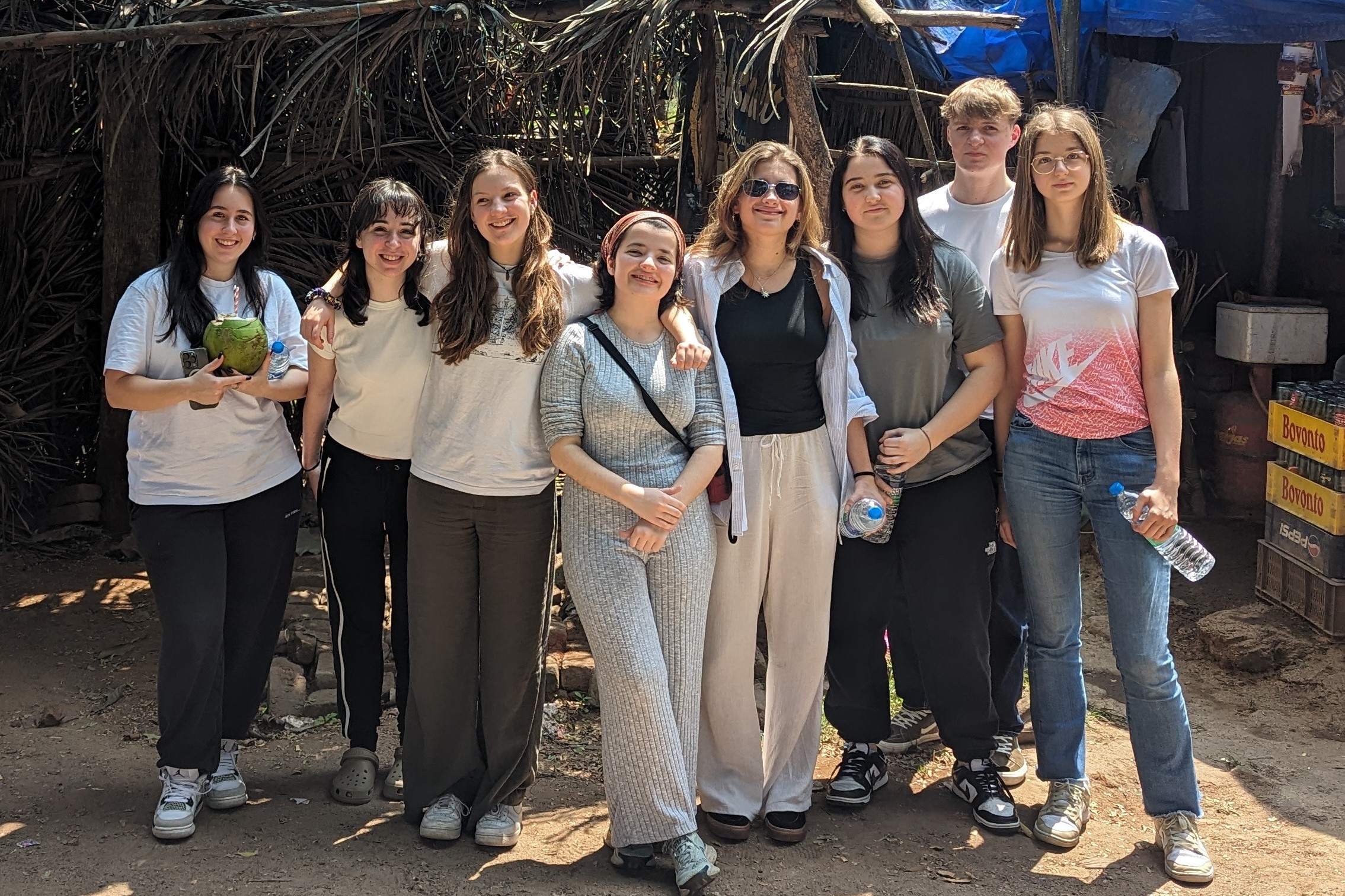group of teenagers girls and boys in summer sunshine