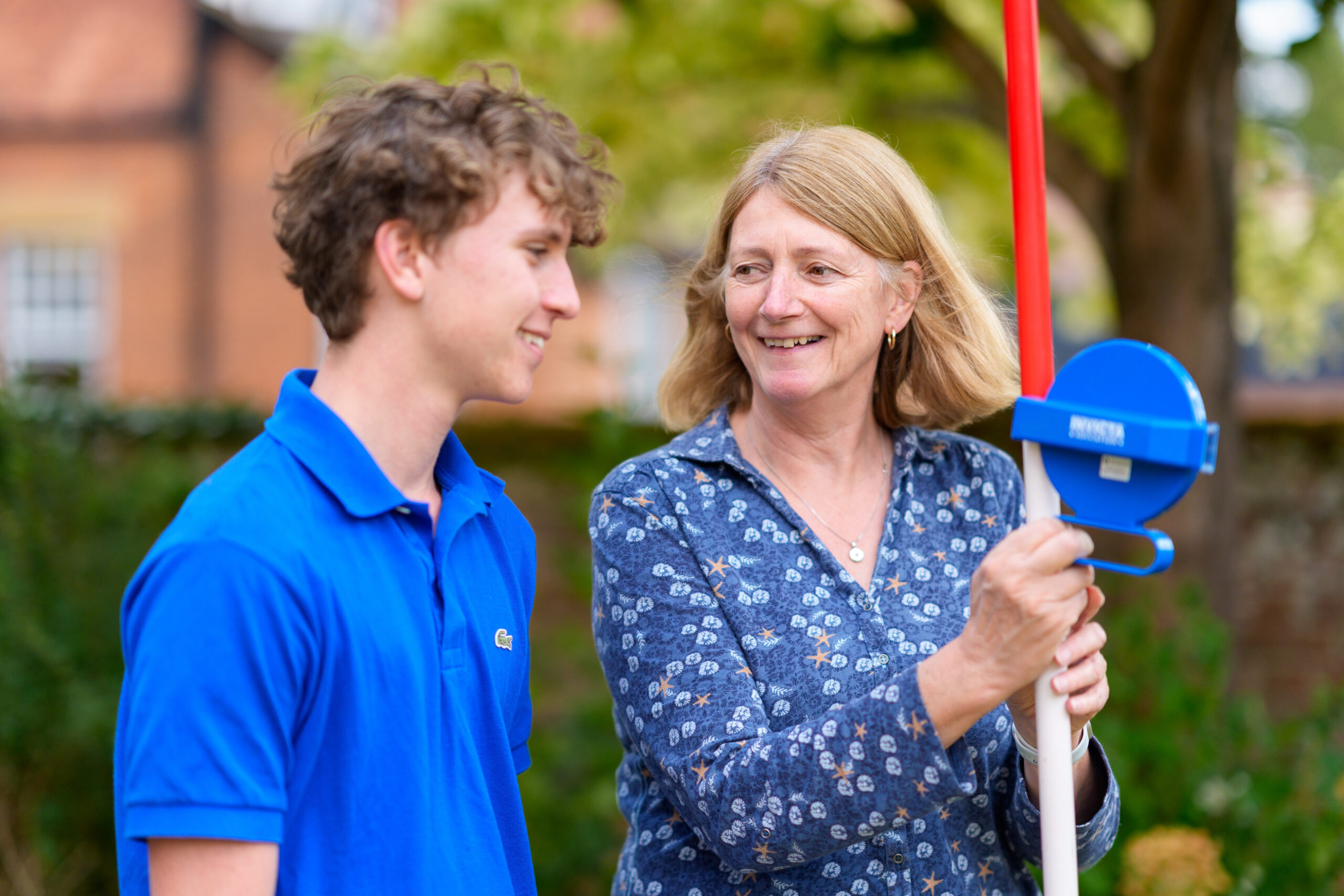 group of teenagers girls and boys in summer sunshine